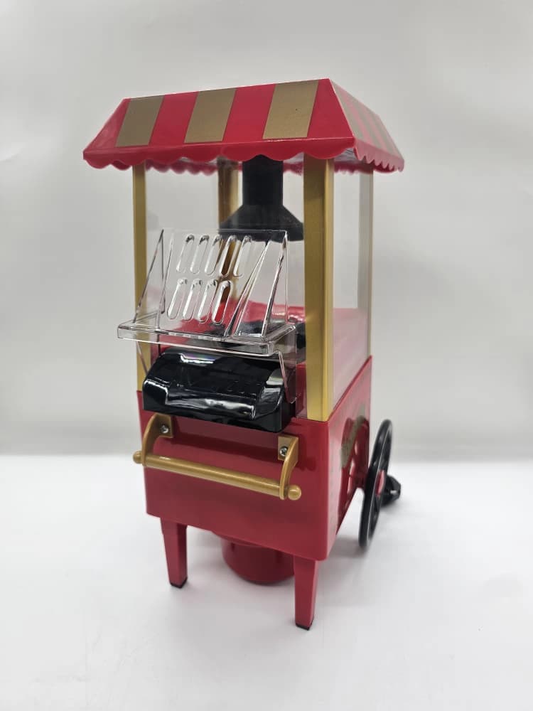 Machine à pop-corn à air chaud de table, style rétro rouge et or conçue comme un chariot de fête foraine vintage